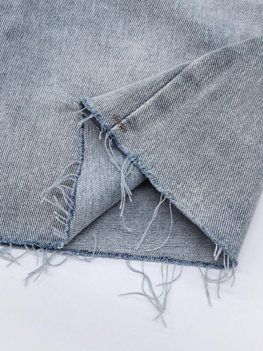 Y2K distressed mini skort with button and pocket details, natural mid waist, regular fit, and casual streetwear styling.