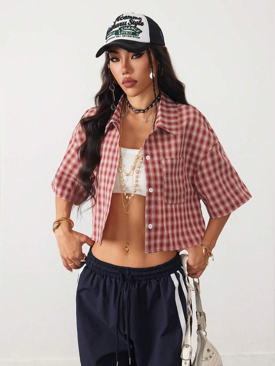 Women's plaid crop shirt with button front, chest pocket, short sleeves, and loose casual fit.
