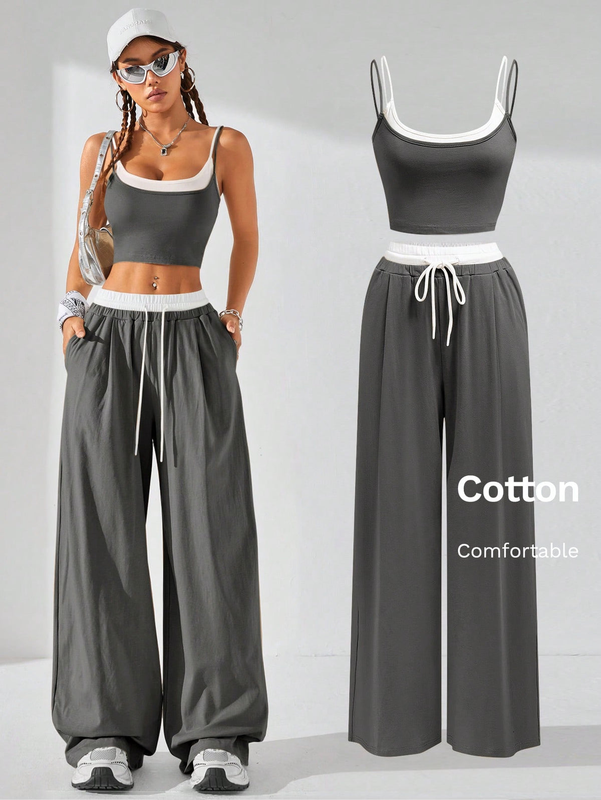 Dark grey women's two-piece outfit featuring a spaghetti strap cami crop top with contrast binding and matching wide-leg drawstring knit lounge pants.