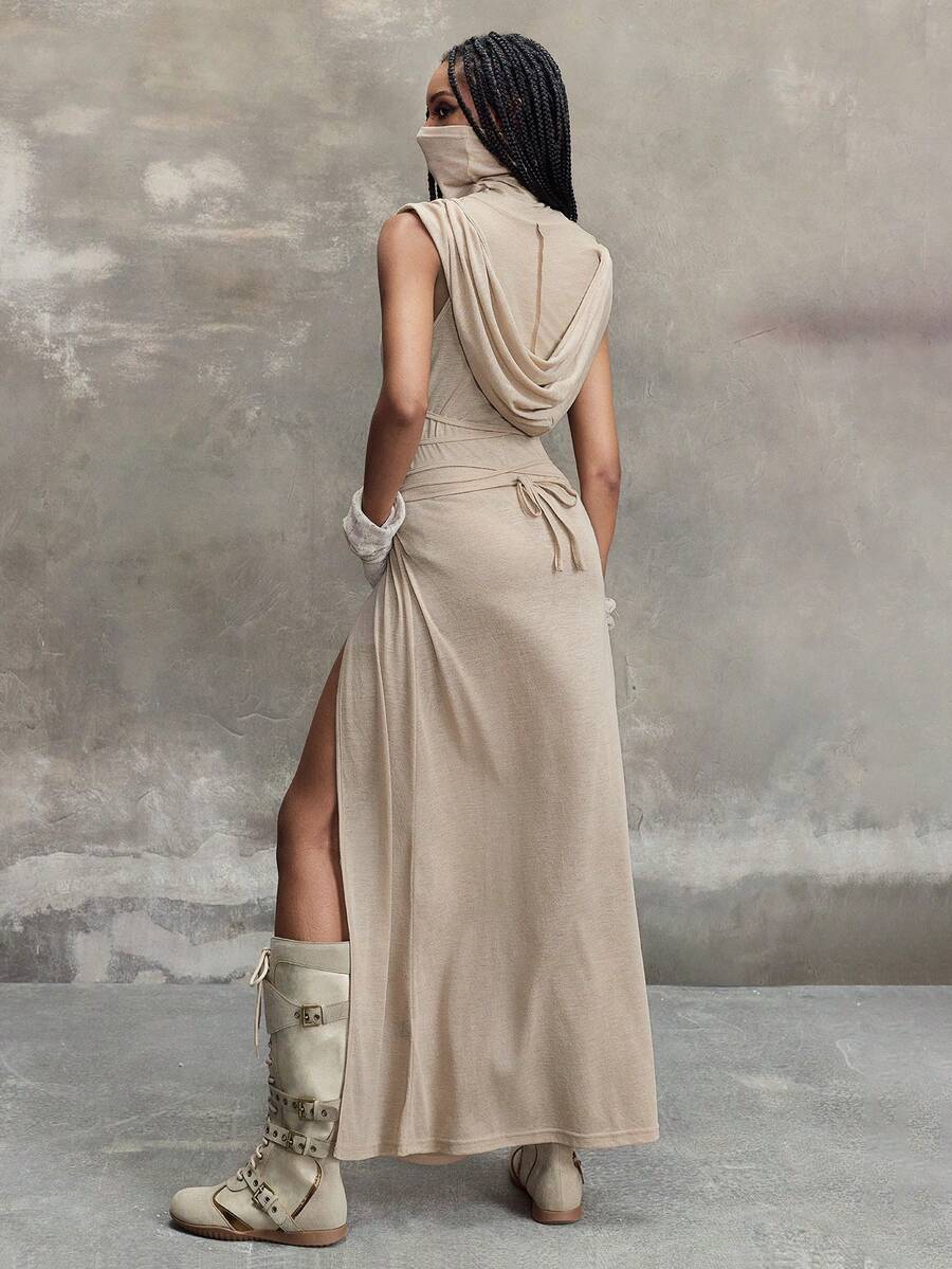 Women's sleeveless hooded maxi dress featuring a plunging neckline, backless design, and high thigh split in a lightweight knit fabric.