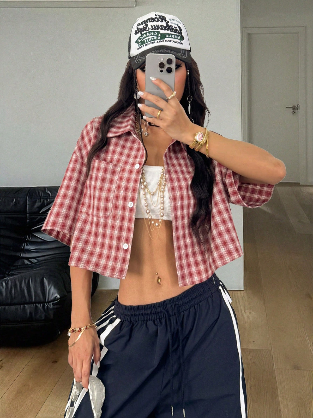 Women's plaid crop shirt with button front, chest pocket, short sleeves, and loose casual fit.