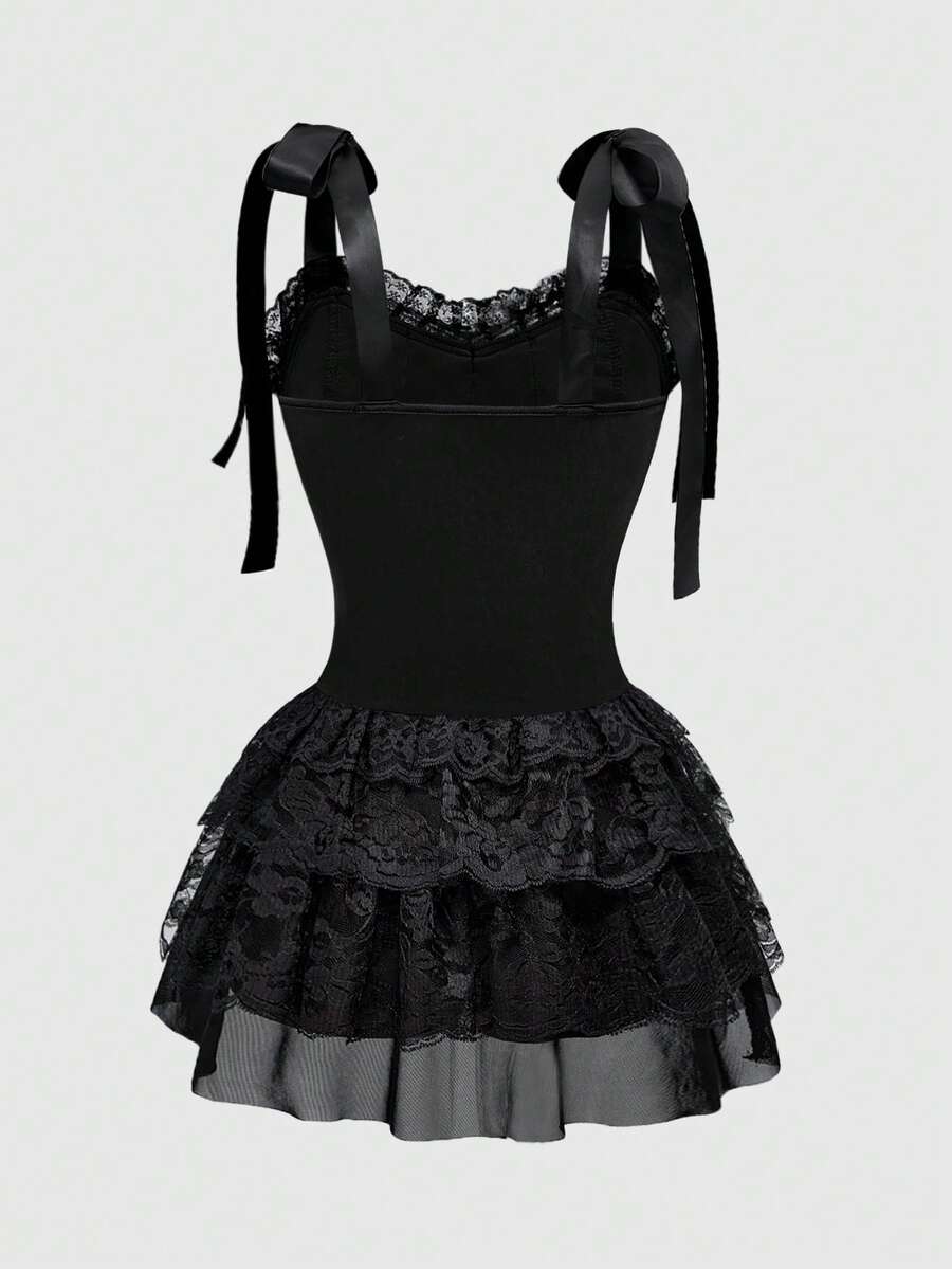 Gothic velvet halter mini dress with contrast lace trim, bow detail, lace-up accents, arm sleeves, layered hem, and cross pendant.