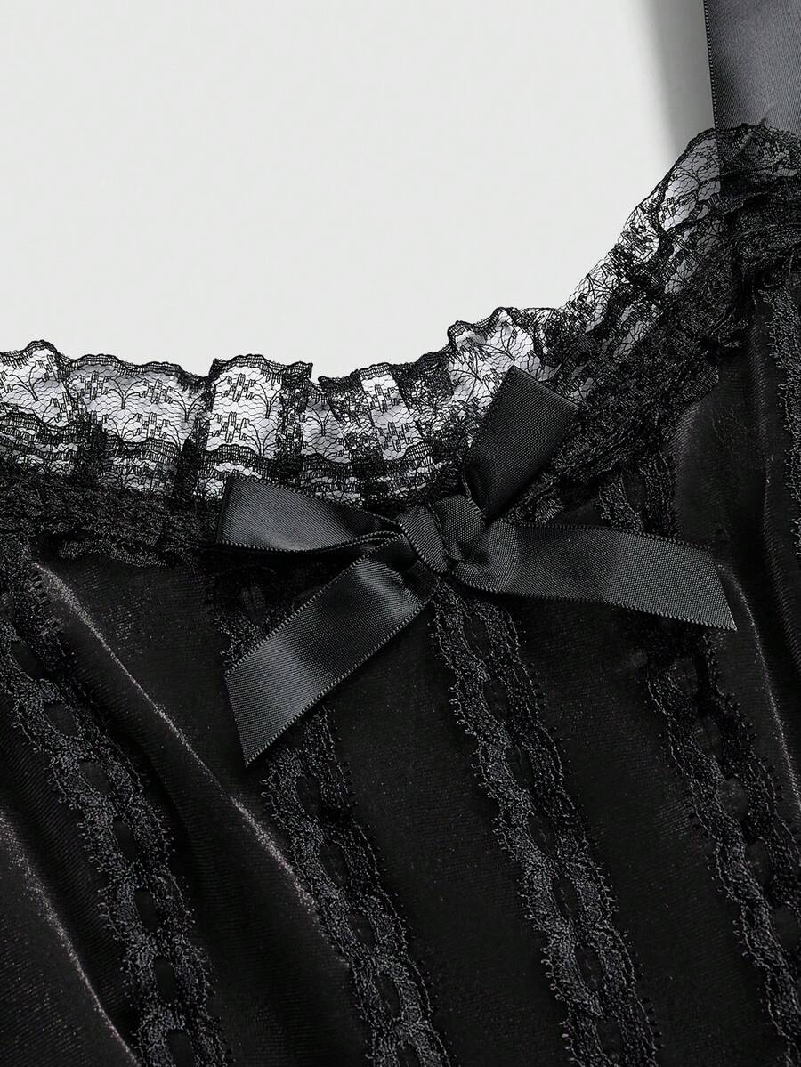 Gothic velvet halter mini dress with contrast lace trim, bow detail, lace-up accents, arm sleeves, layered hem, and cross pendant.