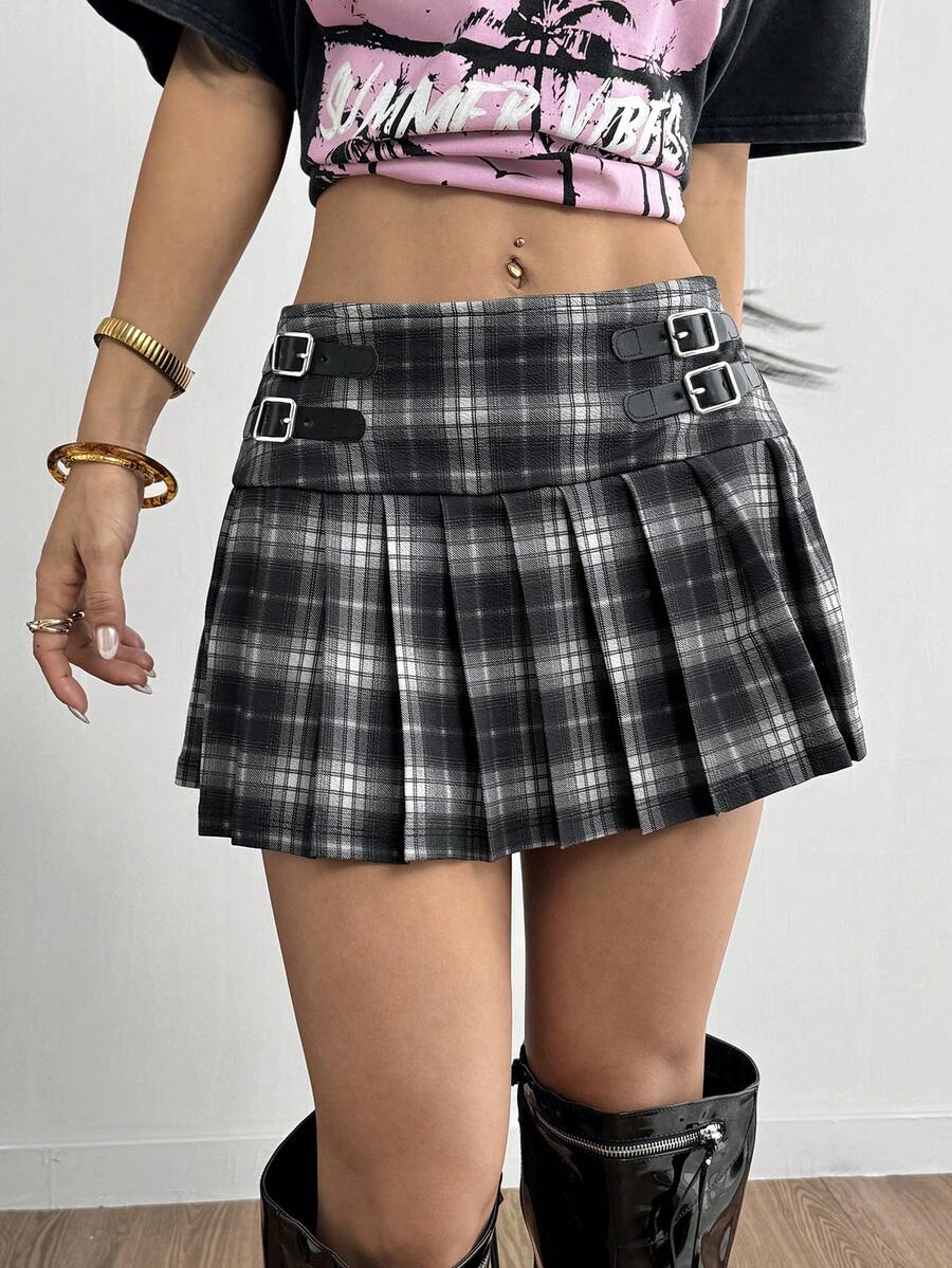 Women's black low waist pleated mini skirt featuring grommet eyelet accents and zipper closure
