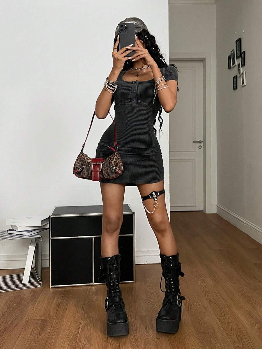 Front view of a women's short sleeve rib knit mini dress with a scoop neck and button-down front in a slim bodycon fit.