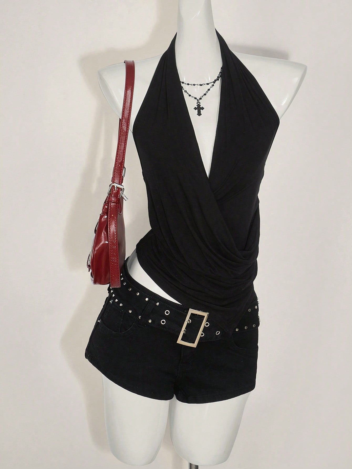 Women's asymmetrical hem halter tank top with draped neckline, backless wrap styling, and grommet eyelet details