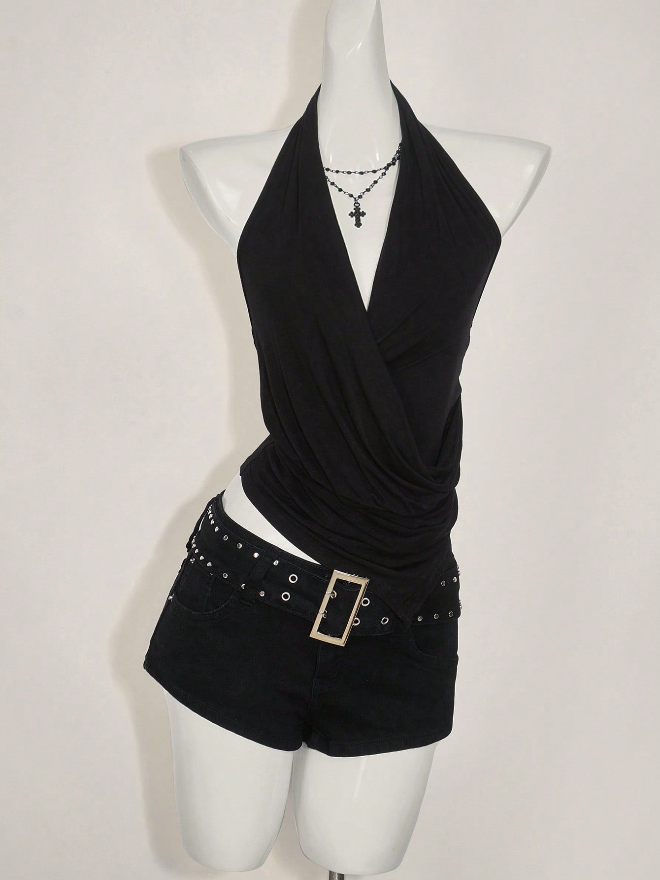 Women's asymmetrical hem halter tank top with draped neckline, backless wrap styling, and grommet eyelet details