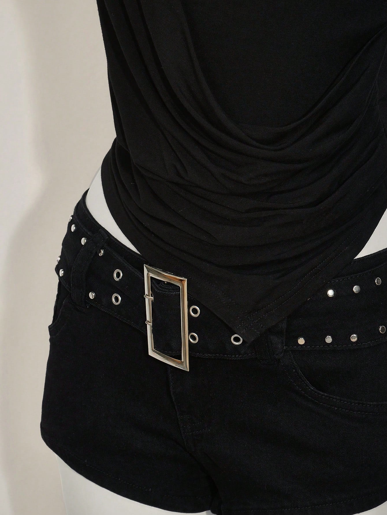 Women's asymmetrical hem halter tank top with draped neckline, backless wrap styling, and grommet eyelet details