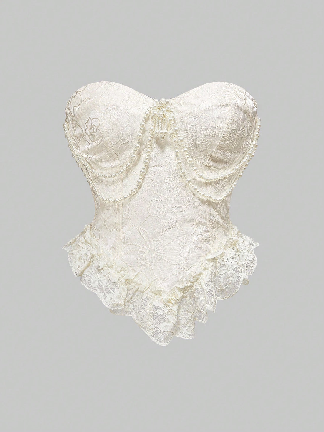 Women's apricot strapless vintage palace style blouse featuring an asymmetrical ruffle hem, backless design, and pearl brooch detail.