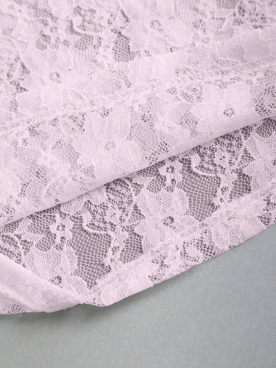 Women's solid lace halter top featuring a backless slim fit design with semi-sheer lace detail.