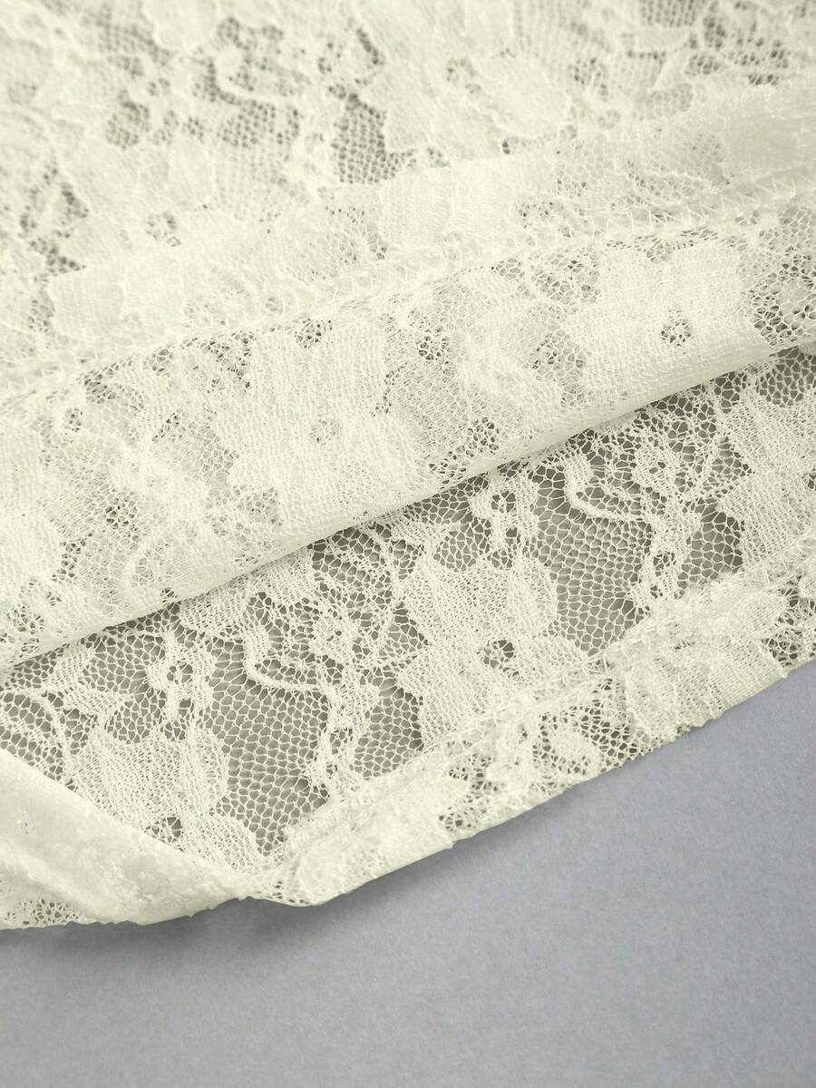 Women's solid lace halter top featuring a backless slim fit design with semi-sheer lace detail.