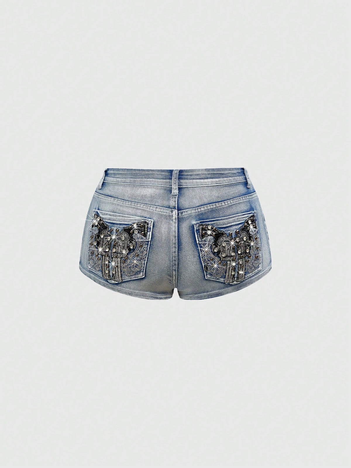 Women's ultra low waist skort with mini shorts length, zipper fly, pockets, pistol embroidery, and rhinestone details