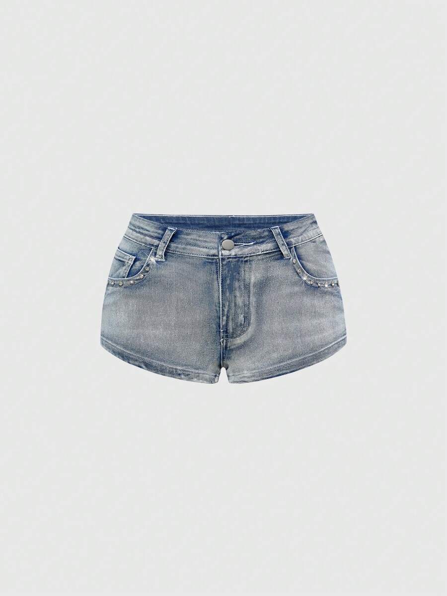 Women's ultra low waist skort with mini shorts length, zipper fly, pockets, pistol embroidery, and rhinestone details