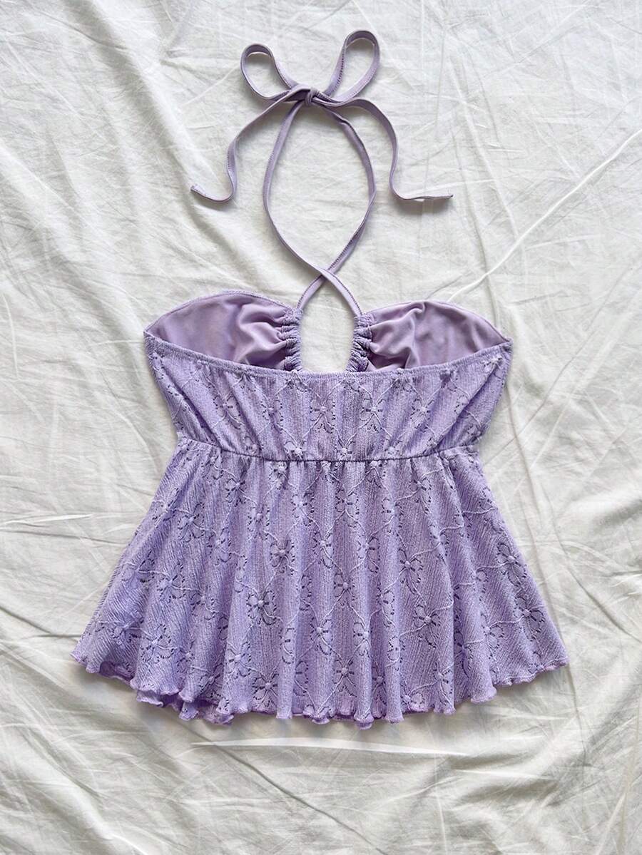 Women's textured V-neck halter tank top with backless knot detail, ruffle hem, and flared silhouette for casual beach and vacation wear.