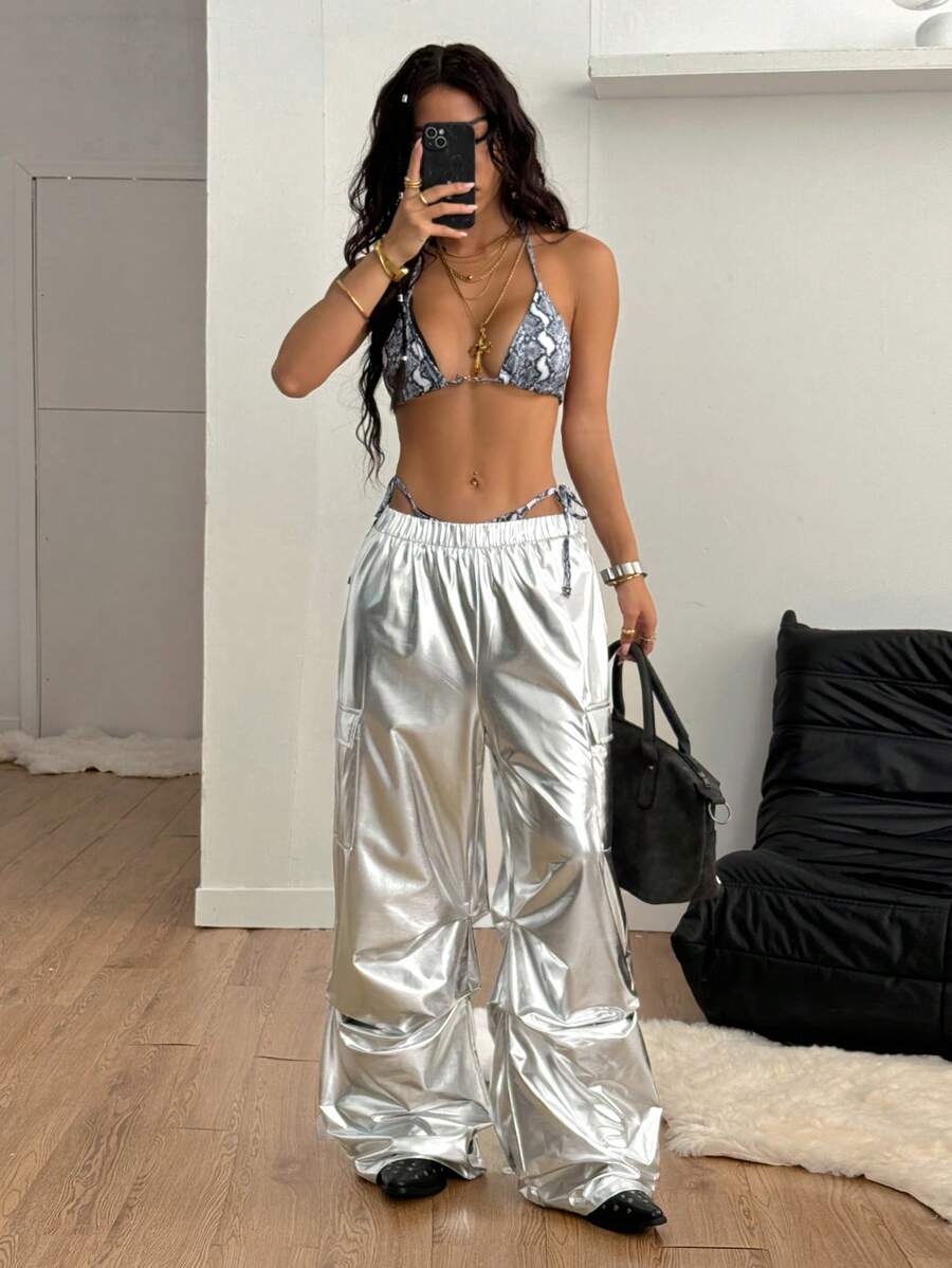 Women's high waist wide leg cargo pants featuring a black and white tree branch print and adjustable drawstring closure.