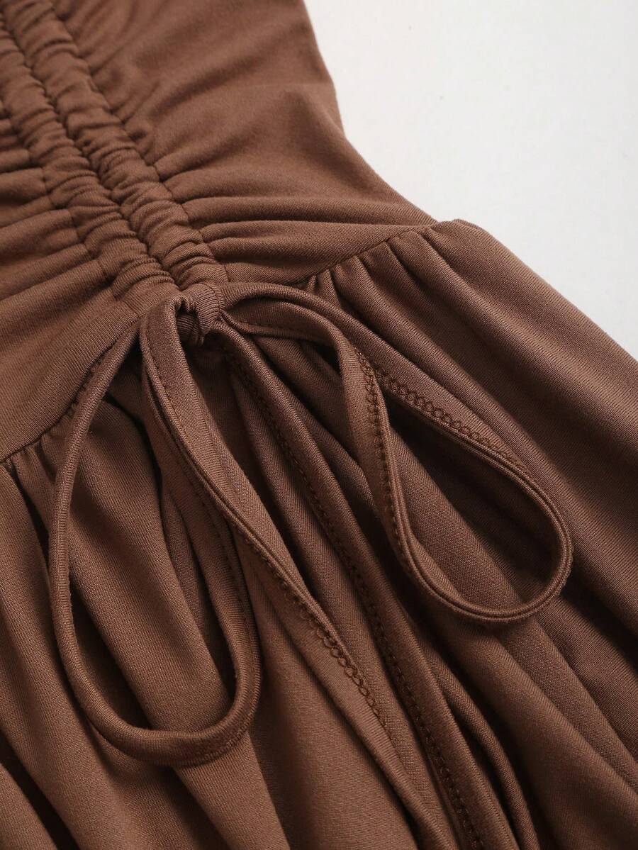 Women's sleeveless halter short dress with a backless design, ruched drawstring detail, slim fit, and asymmetrical hem.
