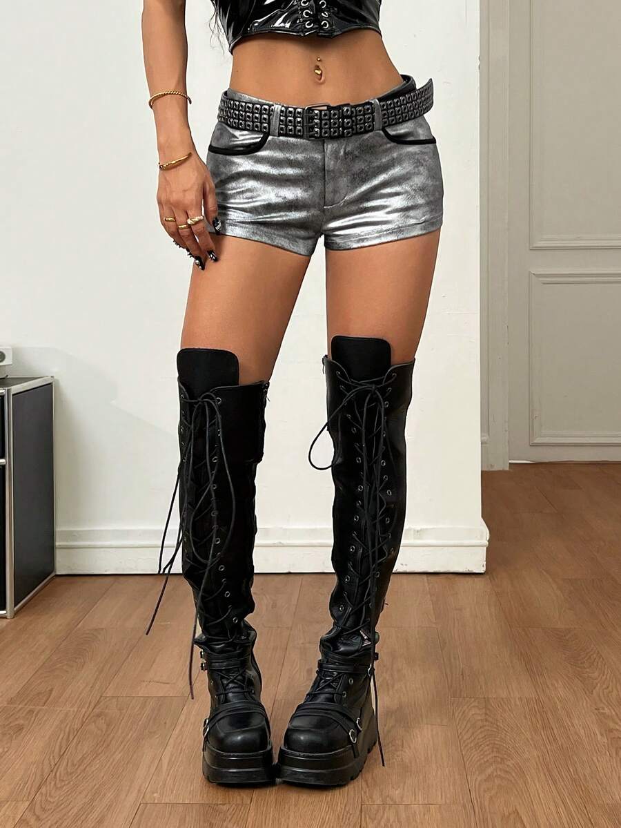 Women's metallic sequin ultra low waist mini shorts with zipper fly, grommet eyelet accents, straight leg cut, and skinny fit for party, concert, festival, and night out styling.