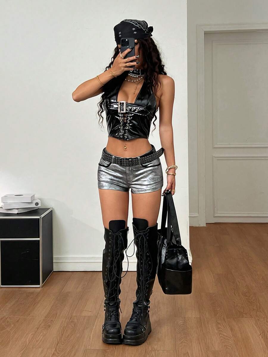 Women's metallic sequin ultra low waist mini shorts with zipper fly, grommet eyelet accents, straight leg cut, and skinny fit for party, concert, festival, and night out styling.