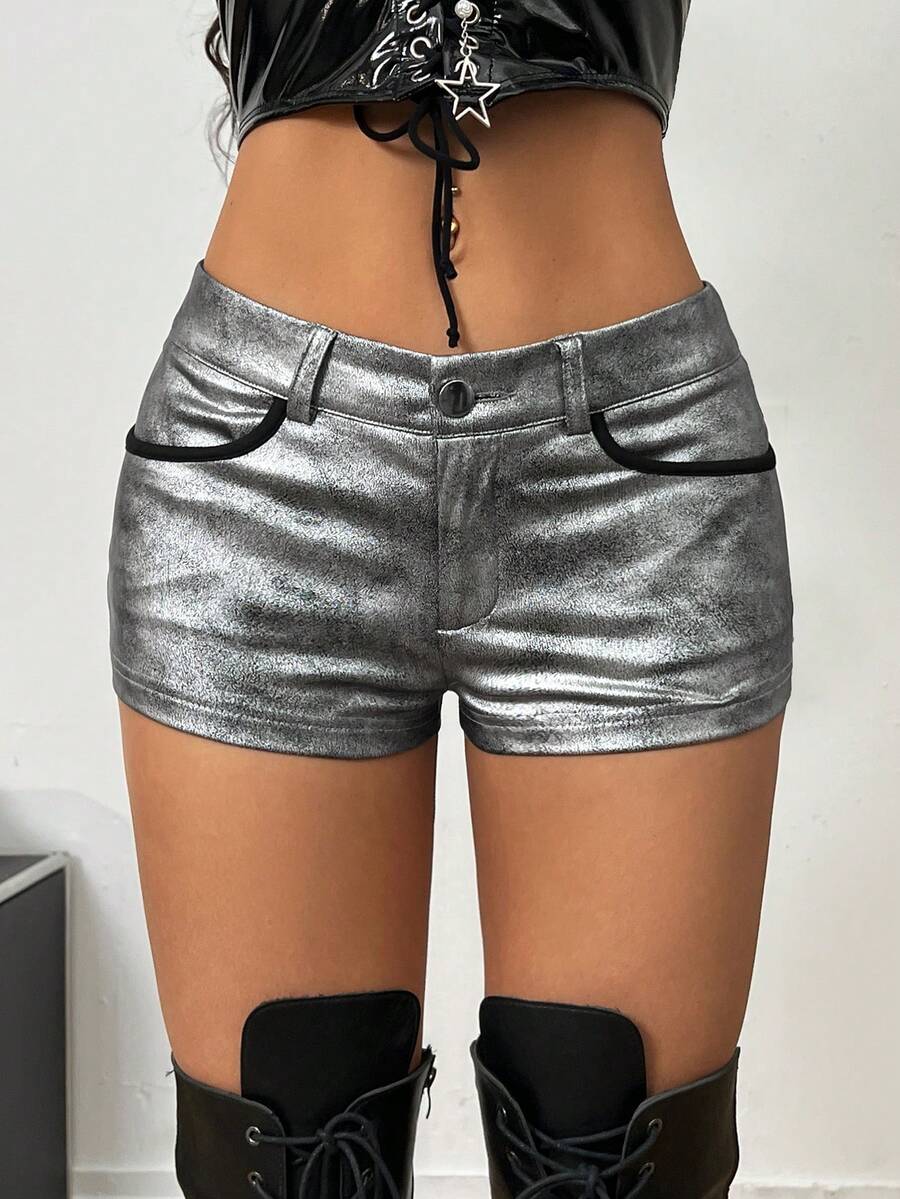 Women's metallic sequin ultra low waist mini shorts with zipper fly, grommet eyelet accents, straight leg cut, and skinny fit for party, concert, festival, and night out styling.