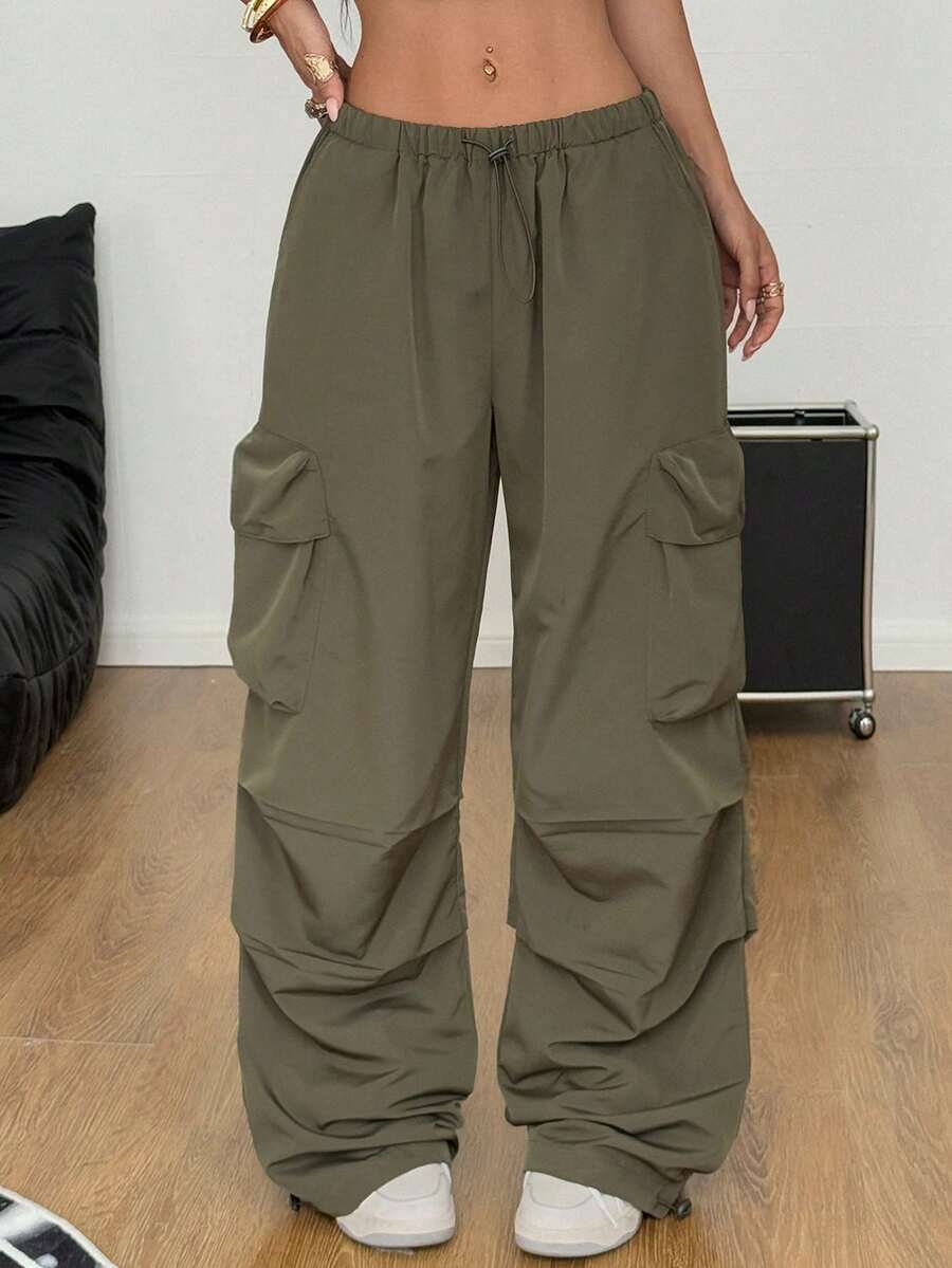 Women's loose fit parachute cargo pants featuring a drawstring waist and functional pockets in a casual streetwear style