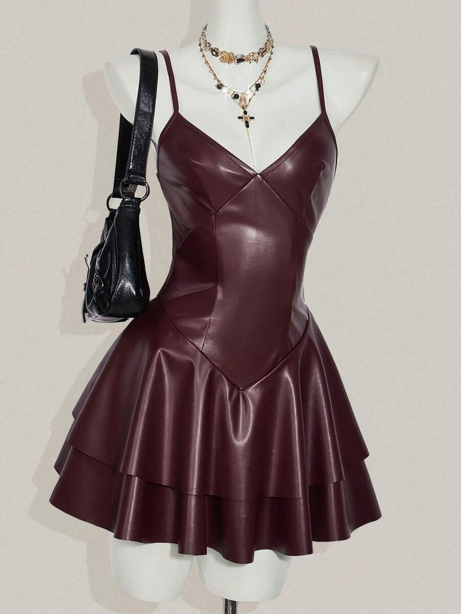 Women's Y2K PU leather mini dress with spaghetti straps, V-neckline, backless design, zipper closure, high waist, slim A-line fit, and layered tiered hem.
