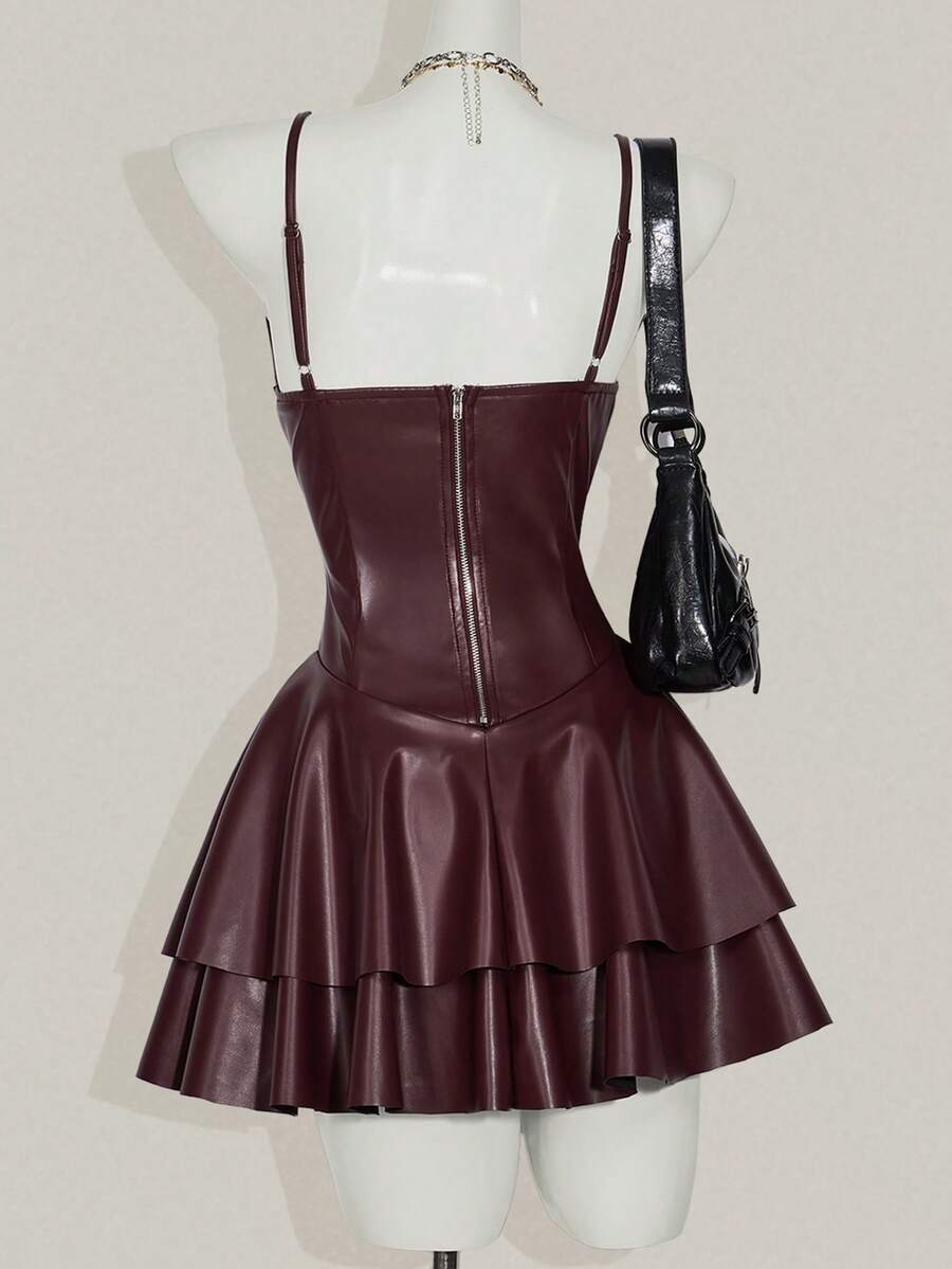 Women's Y2K PU leather mini dress with spaghetti straps, V-neckline, backless design, zipper closure, high waist, slim A-line fit, and layered tiered hem.