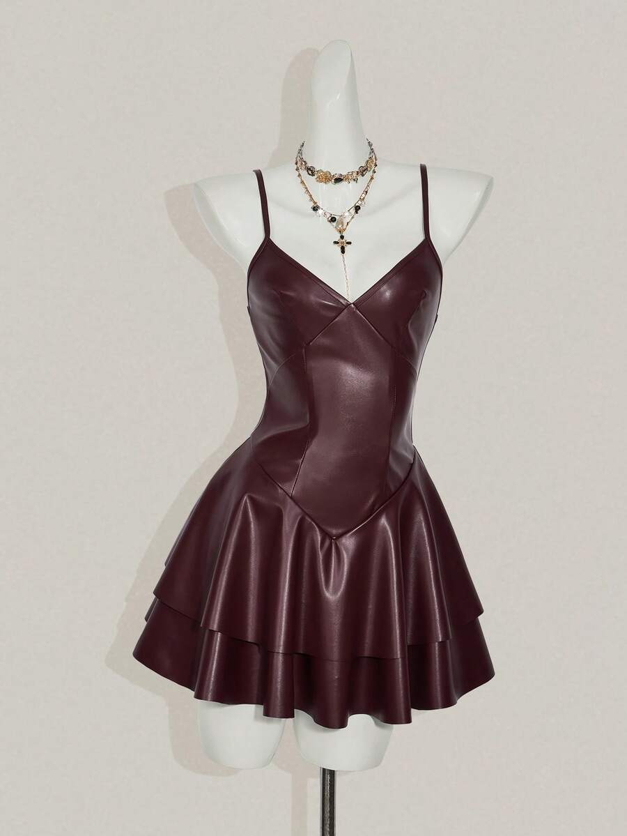 Women's Y2K PU leather mini dress with spaghetti straps, V-neckline, backless design, zipper closure, high waist, slim A-line fit, and layered tiered hem.