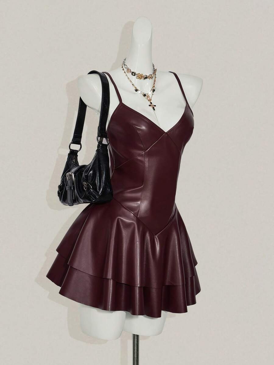 Women's Y2K PU leather mini dress with spaghetti straps, V-neckline, backless design, zipper closure, high waist, slim A-line fit, and layered tiered hem.