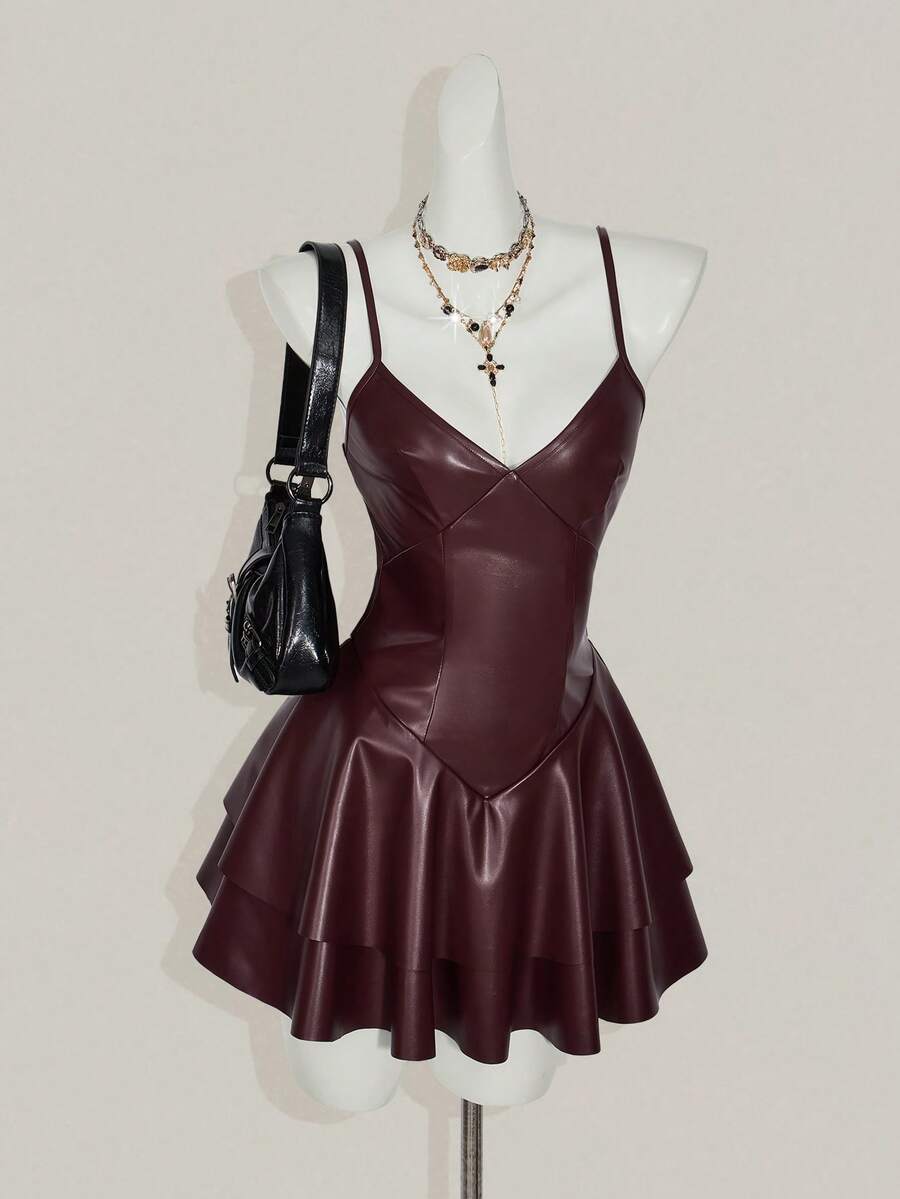 Women's Y2K PU leather mini dress with spaghetti straps, V-neckline, backless design, zipper closure, high waist, slim A-line fit, and layered tiered hem.