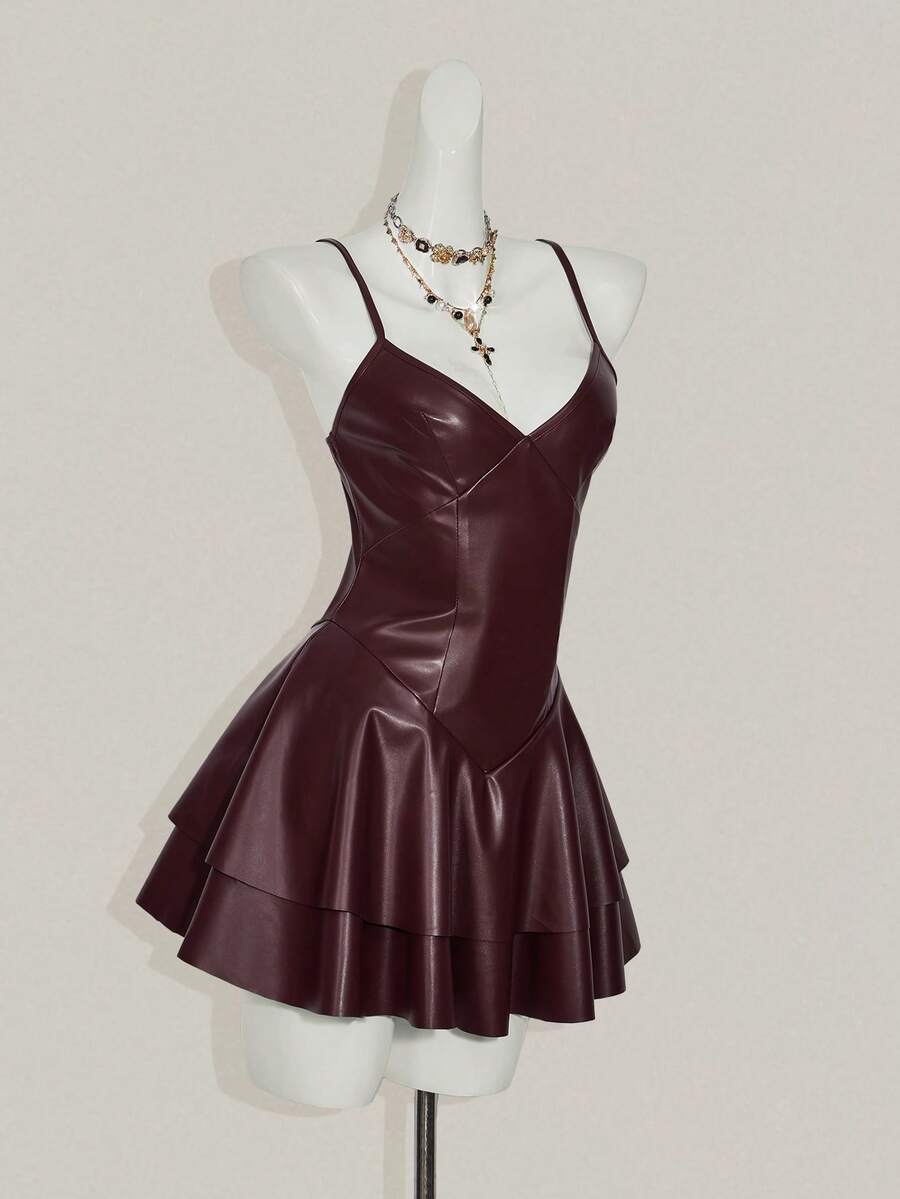 Women's Y2K PU leather mini dress with spaghetti straps, V-neckline, backless design, zipper closure, high waist, slim A-line fit, and layered tiered hem.