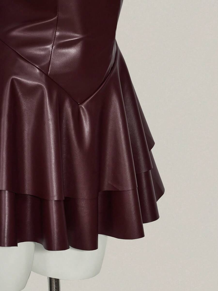 Women's Y2K PU leather mini dress with spaghetti straps, V-neckline, backless design, zipper closure, high waist, slim A-line fit, and layered tiered hem.
