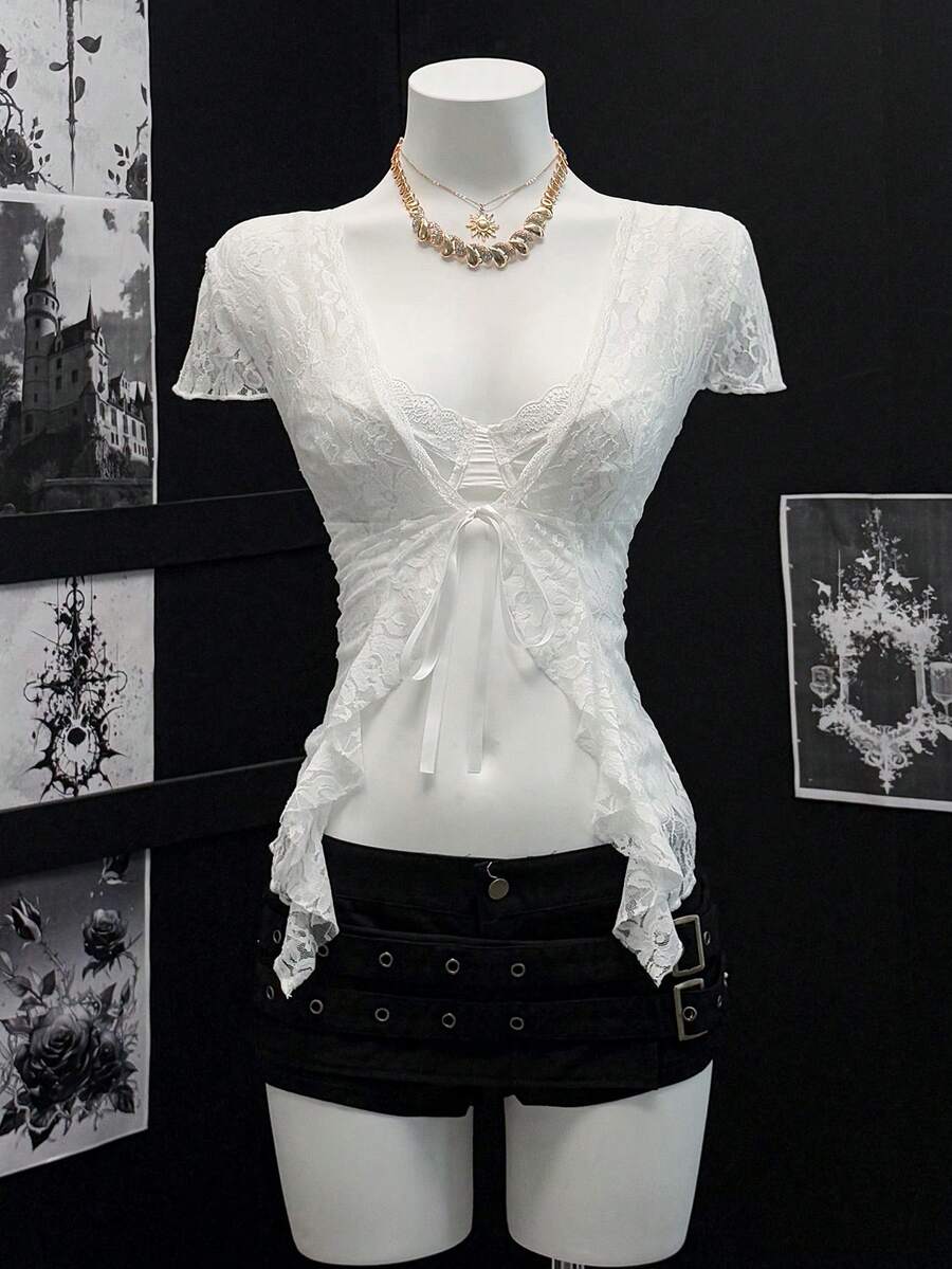 Women's semi-sheer deep V-neck top featuring cap sleeves, contrast lace trimming, and a lace-up front detail.