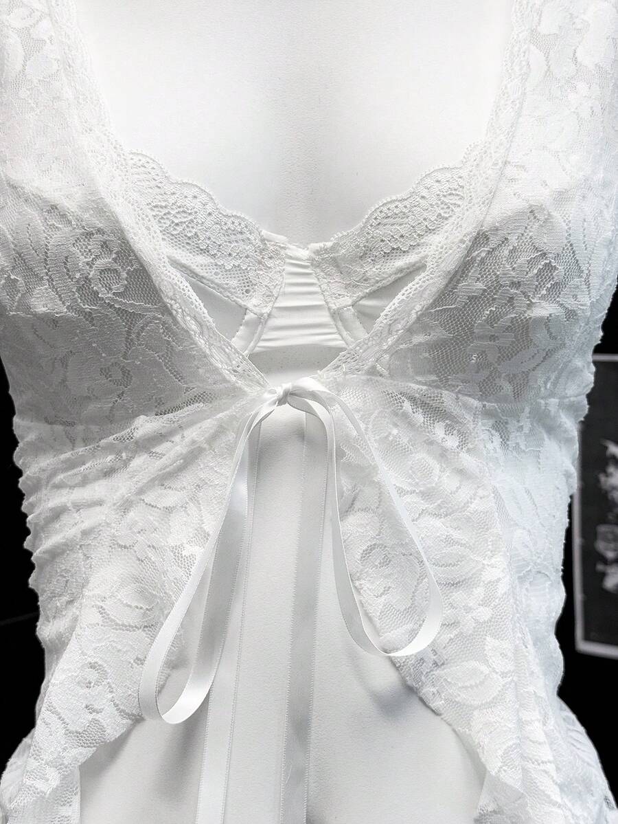 Women's semi-sheer deep V-neck top featuring cap sleeves, contrast lace trimming, and a lace-up front detail.