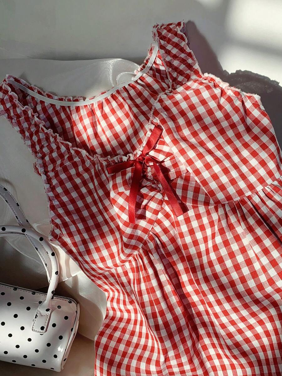 Women's red gingham smocked tank top with scoop neck, ruffle hem, and bow knot detail