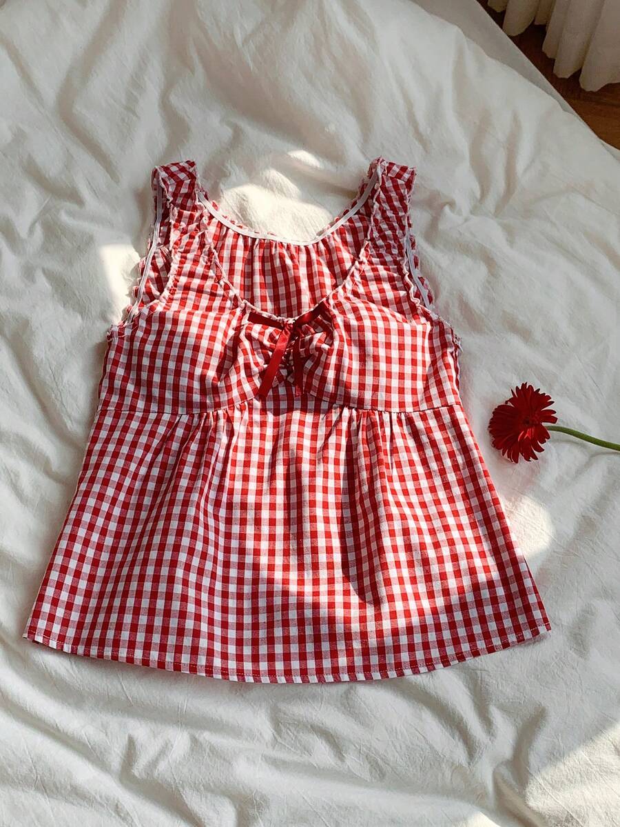 Women's red gingham smocked tank top with scoop neck, ruffle hem, and bow knot detail
