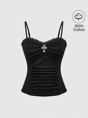 Black gothic spaghetti strap tank top for women featuring contrast lace patchwork, ruched frill details, and a cross pendant accent in a slim fit knitted fabric.