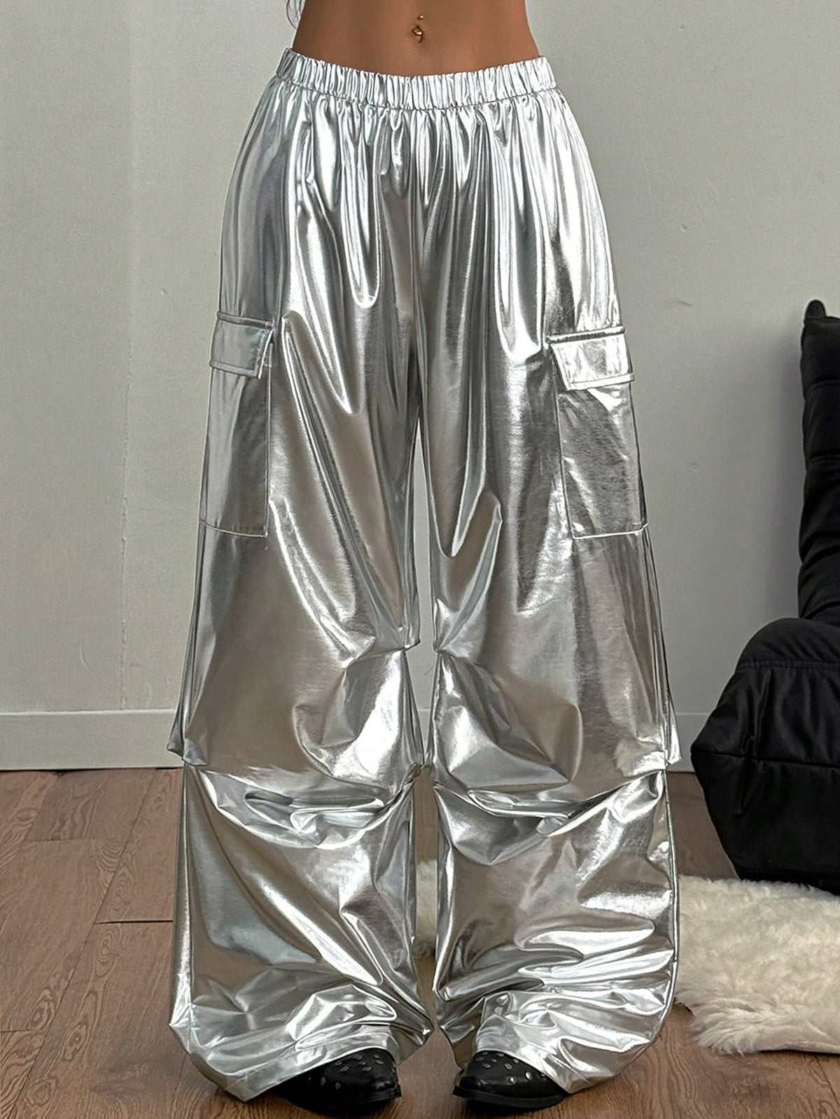 Women's high waist wide leg cargo pants featuring a black and white tree branch print and adjustable drawstring closure.