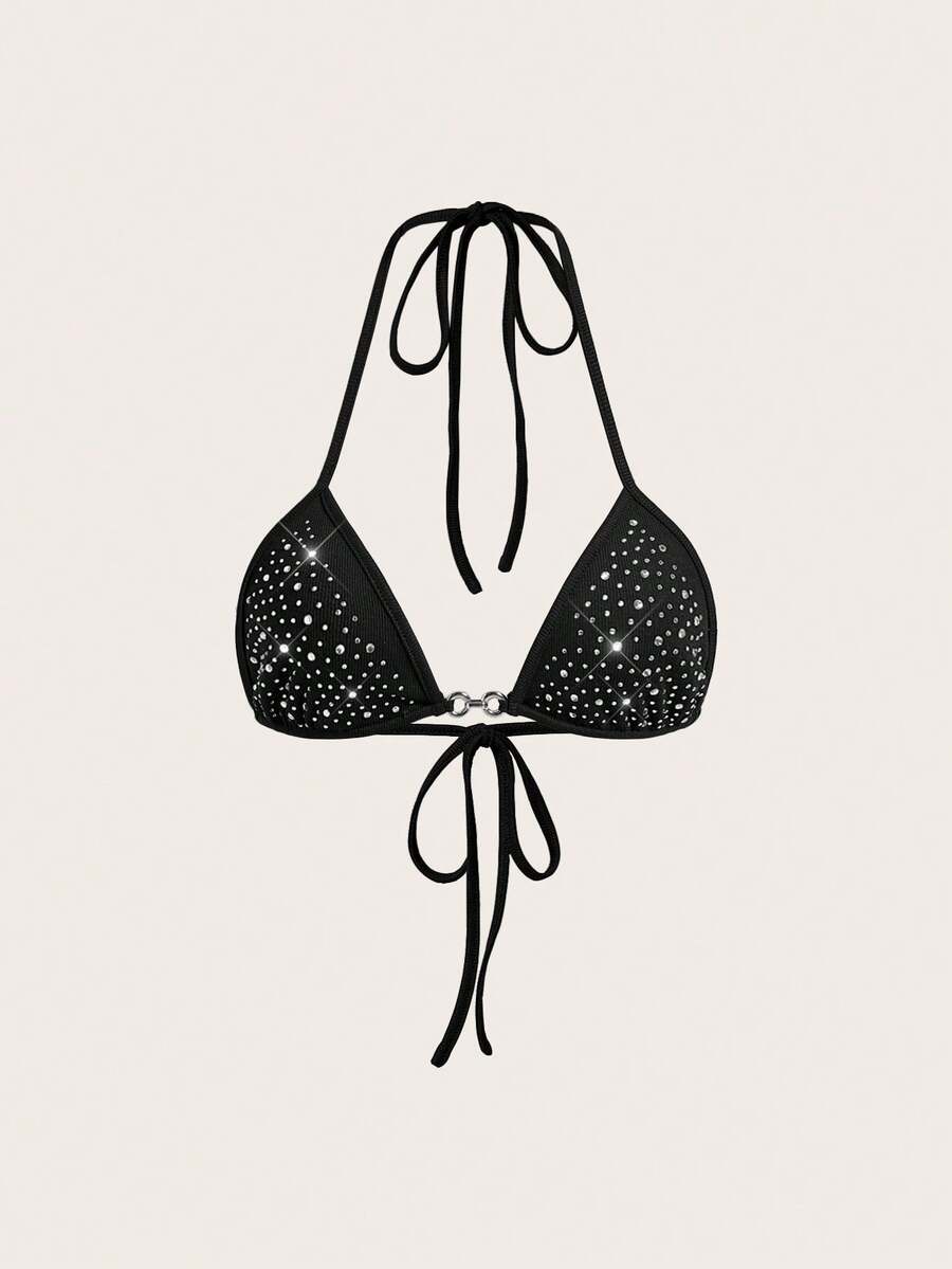 Women's slim fit halter crop top featuring a backless cut with knot and rhinestone accents.