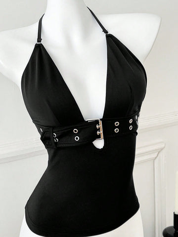 Women's black halter crop tank top with backless design, grommet eyelet detail, slim fit, and medium-stretch knitted fabric.