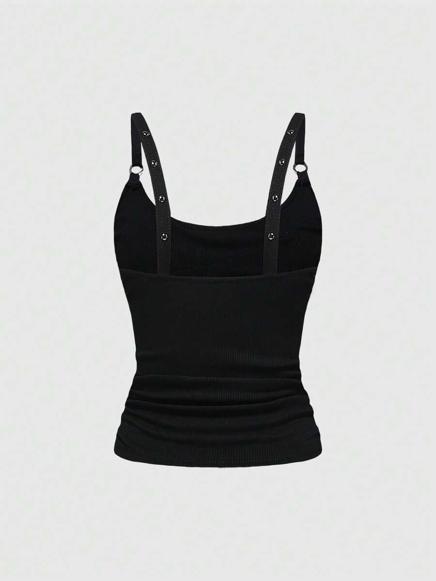 Women's wide-strap cami top featuring a grunge punk design with cut-out details, rhinestone embellishments, and grommet eyelets.