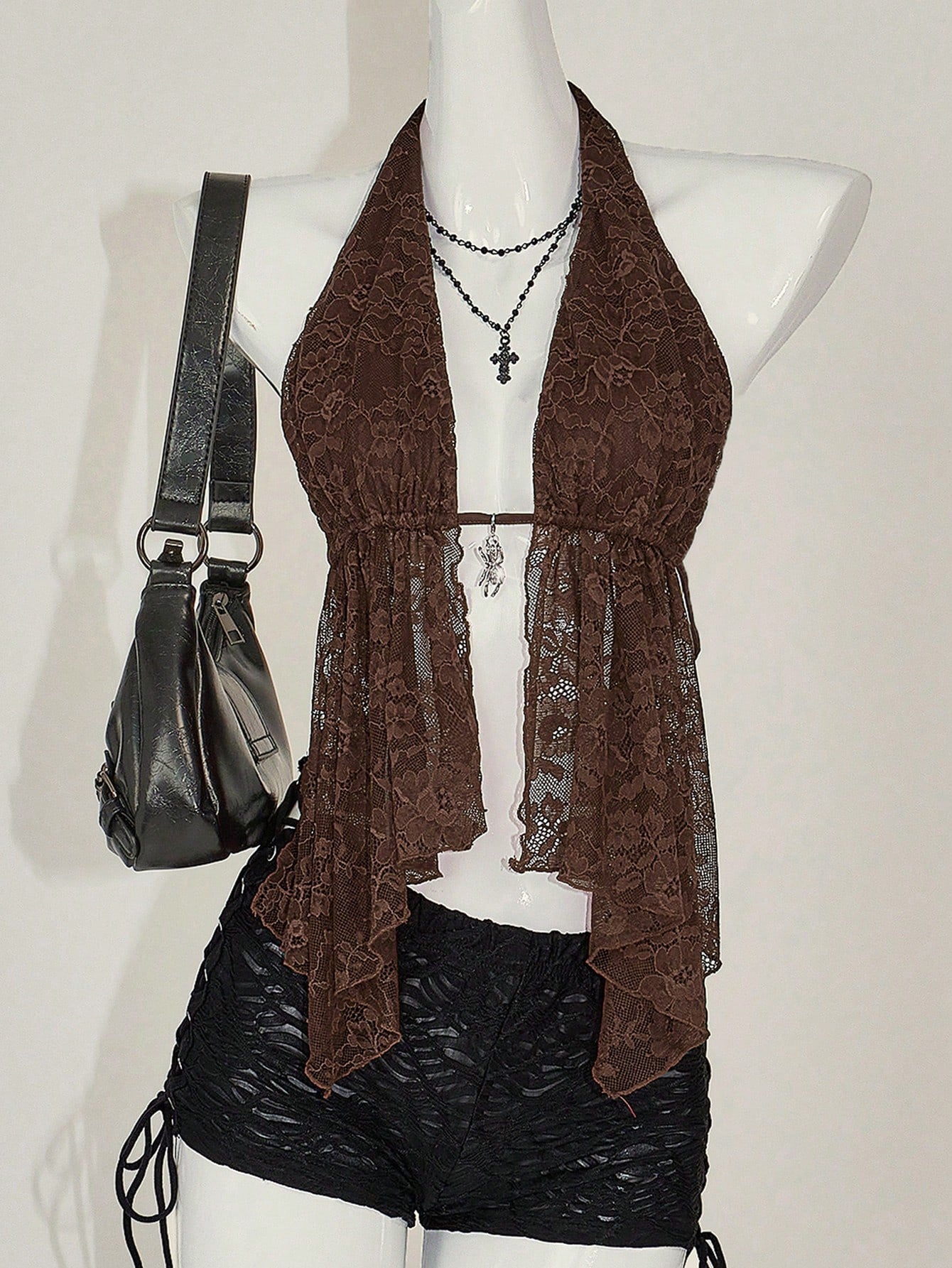 Women's lace halter neck camisole with backless styling, asymmetrical hem, slim fit, and semi-sheer lined design