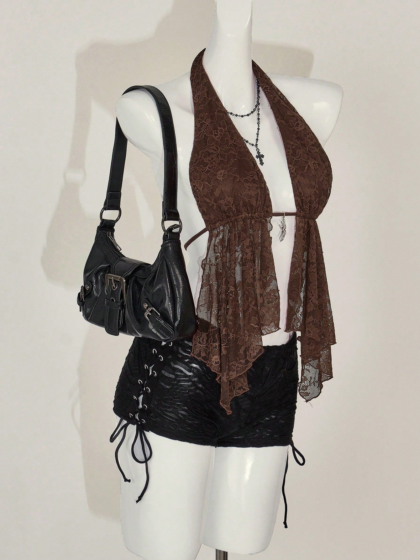 Women's lace halter neck camisole with backless styling, asymmetrical hem, slim fit, and semi-sheer lined design