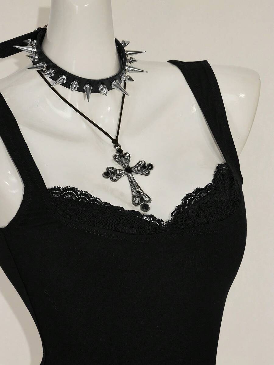 Black sleeveless crop cami top with wide straps, contrast lace trim, rib-knit texture, slim fit, and regular hem