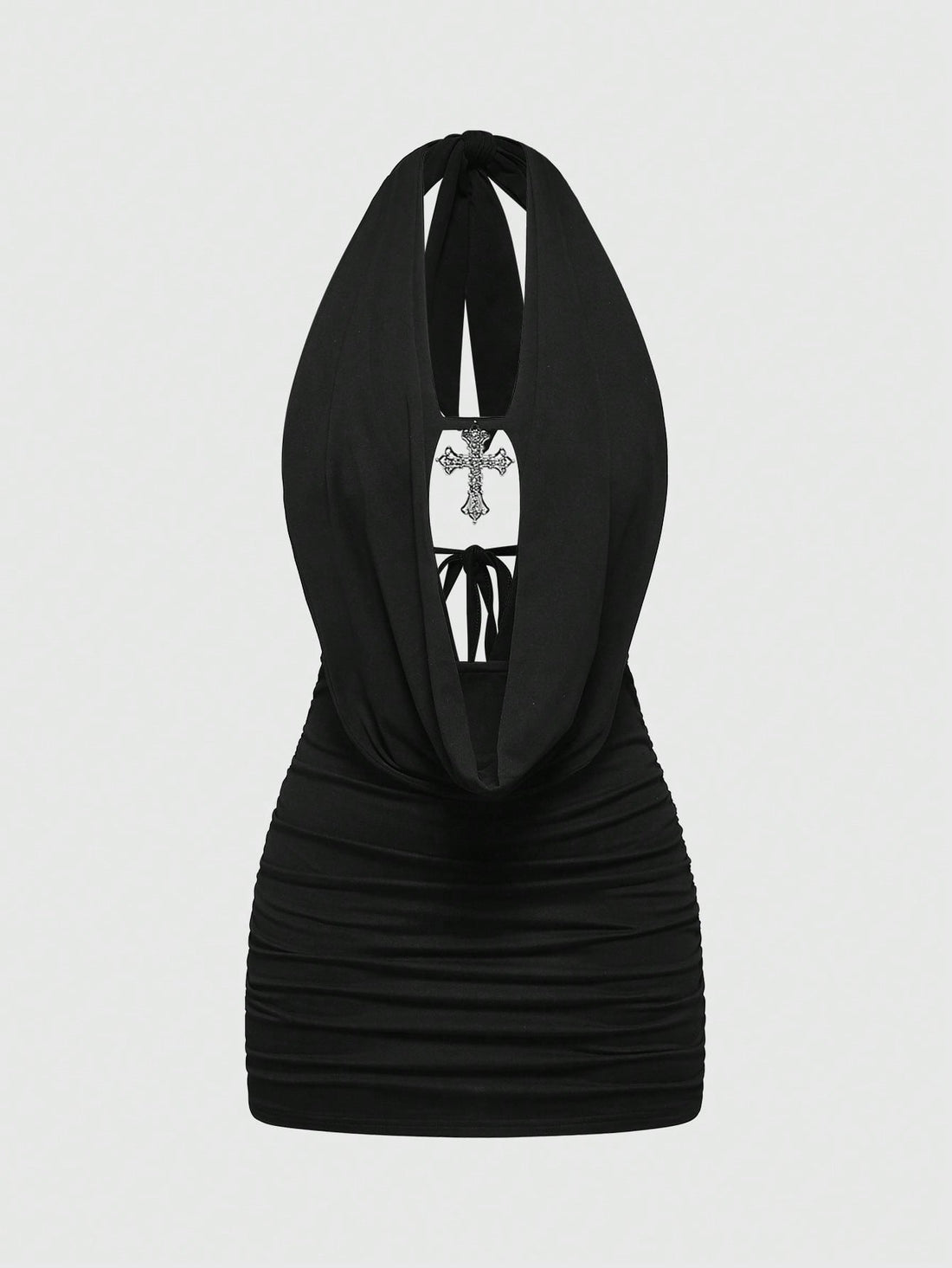 Black backless halter mini dress with ruched details, cut-out back, tied back design, and rhinestone cross pendant accent.