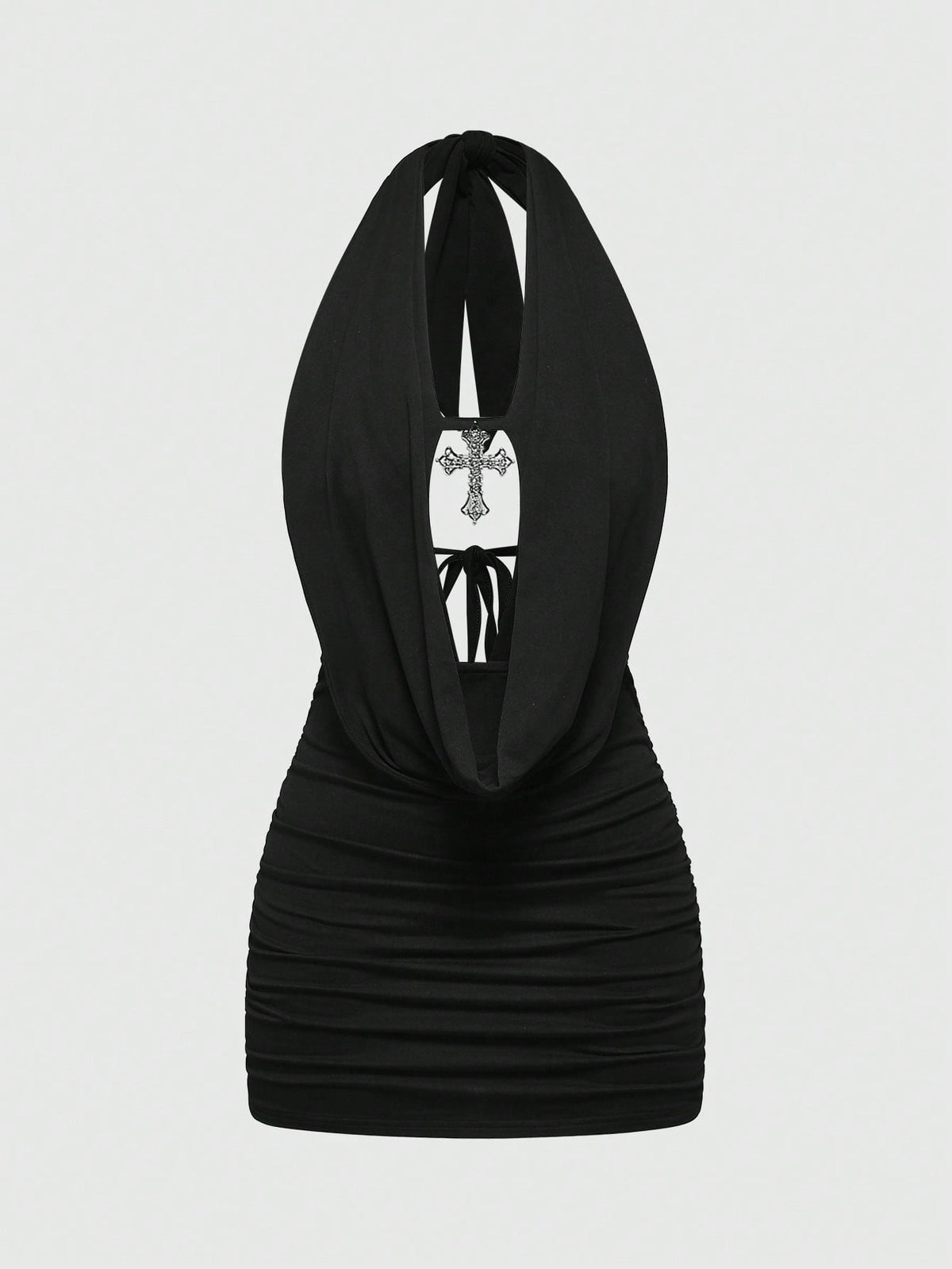 Black backless halter mini dress with ruched details, cut-out back, tied back design, and rhinestone cross pendant accent.