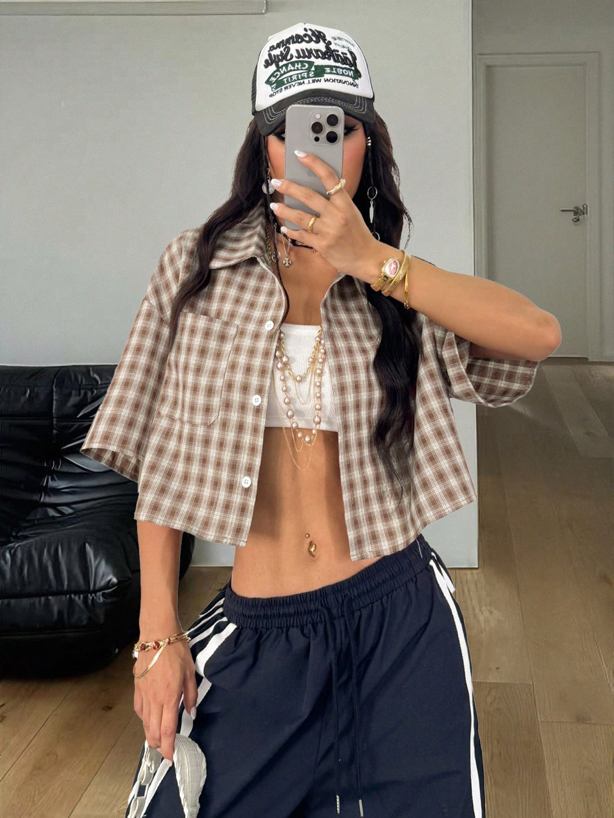 Women's plaid crop shirt with button front, chest pocket, short sleeves, and loose casual fit.