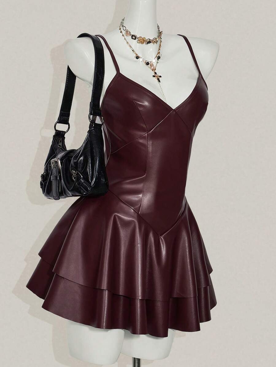 Women's Y2K PU leather mini dress with spaghetti straps, V-neckline, backless design, zipper closure, high waist, slim A-line fit, and layered tiered hem.