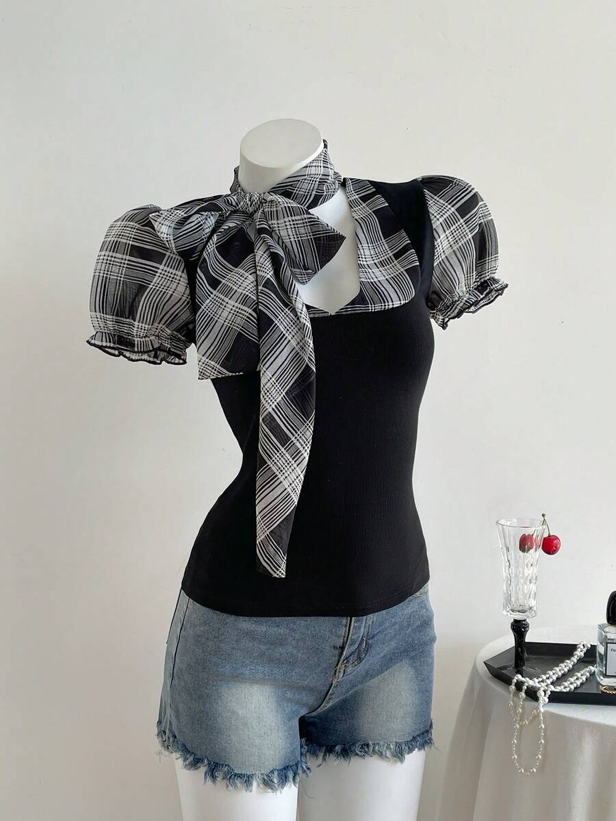 Women's slim fit short sleeve t-shirt featuring puff sleeves, Queen Anne neckline, tie-up front knot, frill detail, and raw hem.