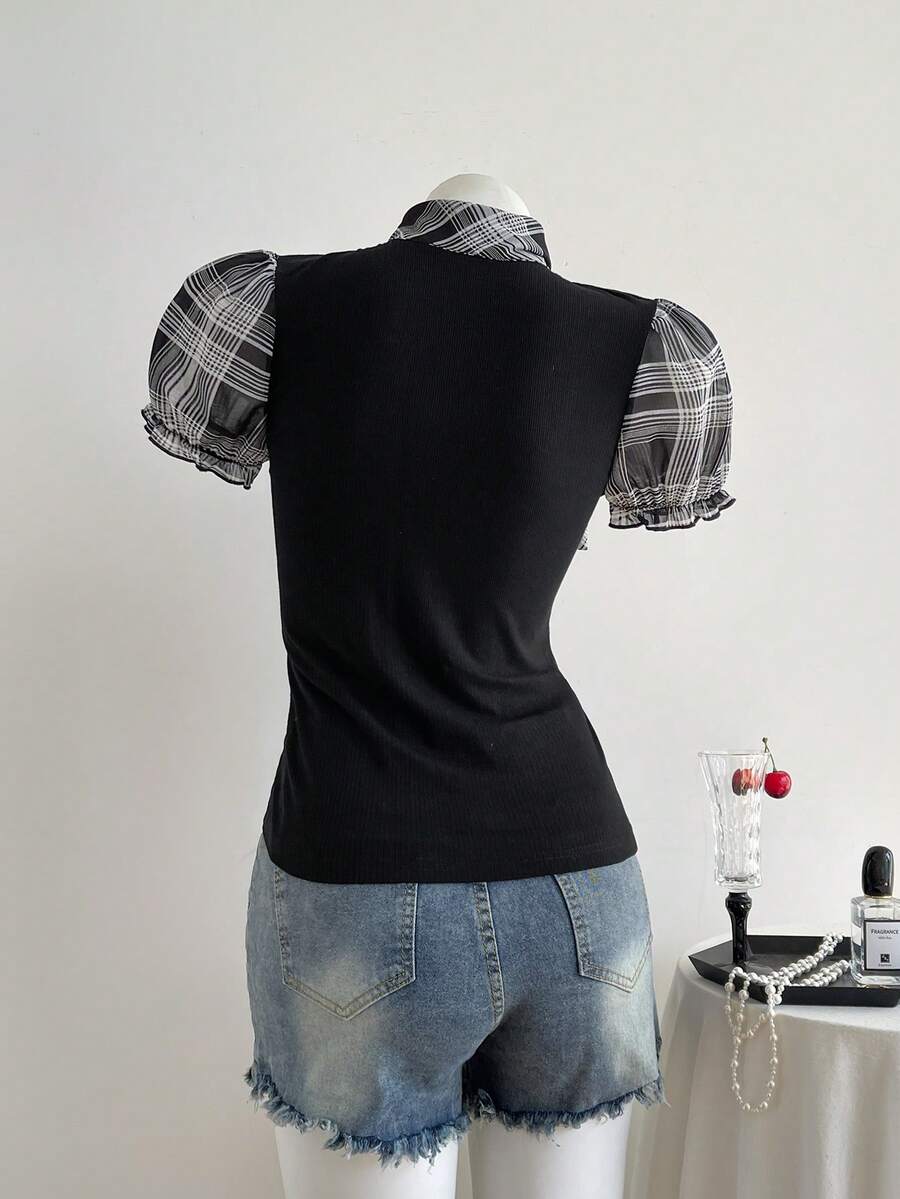 Women's slim fit short sleeve t-shirt featuring puff sleeves, Queen Anne neckline, tie-up front knot, frill detail, and raw hem.