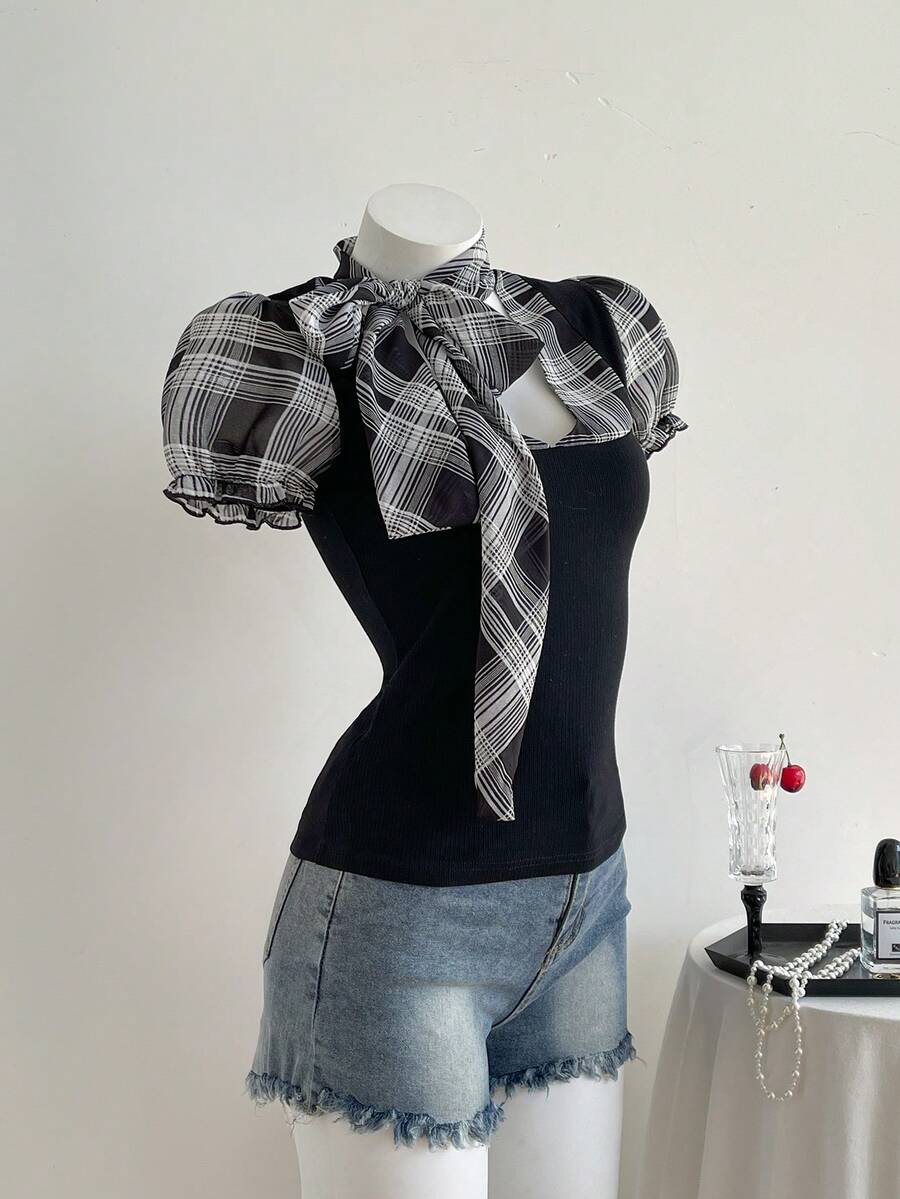 Women's slim fit short sleeve t-shirt featuring puff sleeves, Queen Anne neckline, tie-up front knot, frill detail, and raw hem.